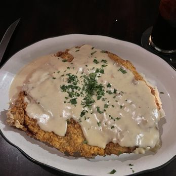 Moonshine Grill signature dishes Chicken Fried SteakGreen Chile Macaroni and CheeseShrimp and GritsSkillet Apple Pie
